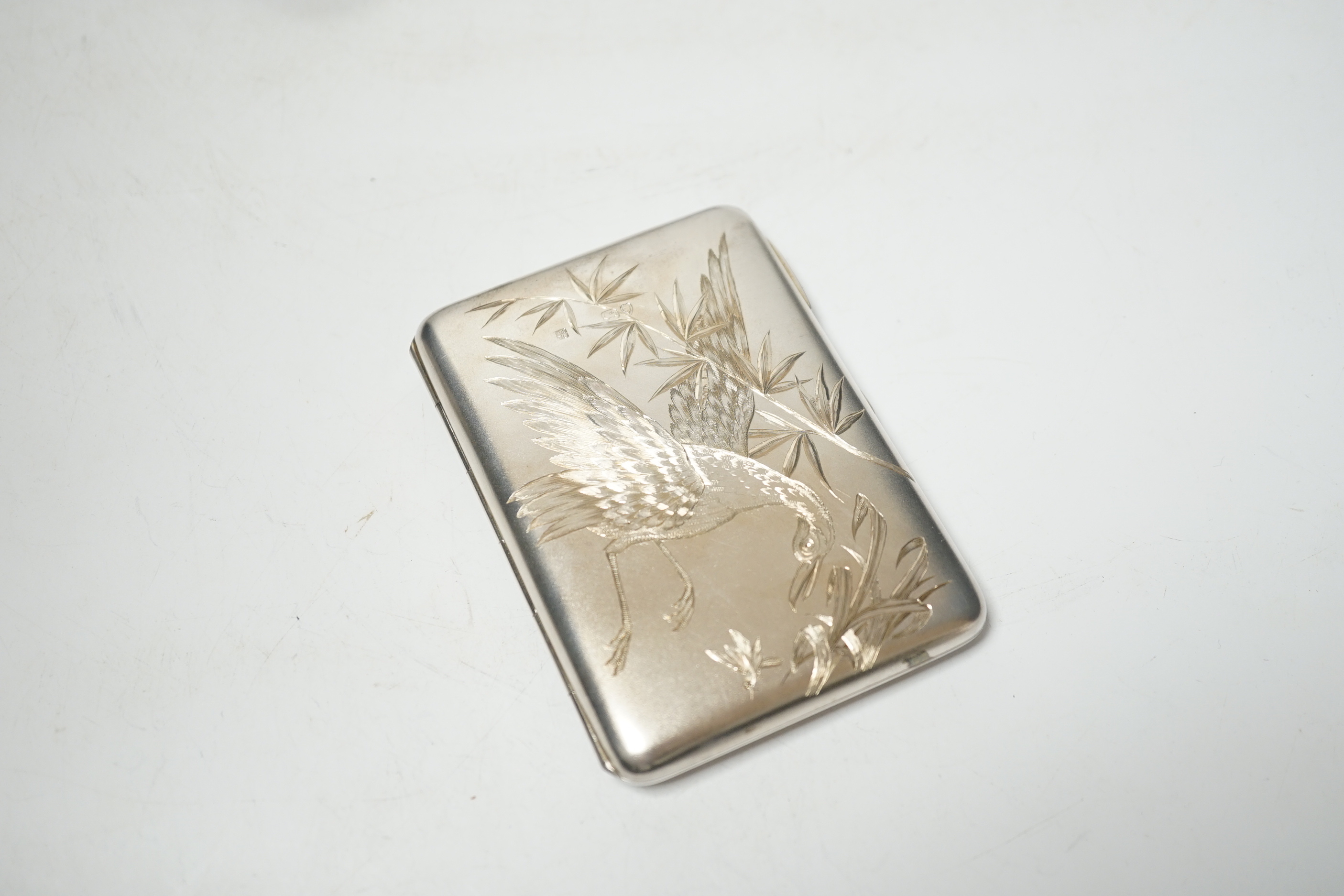 A Victorian aesthetic movement engraved silver card purse, Alfred Hall & John Goode, London, 1885, 10.1cm, in original fitted case.